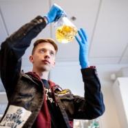 Science student holding an erlenmeyer flask