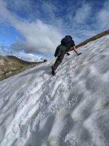 Dr. Simpkins climbing a wall of snow