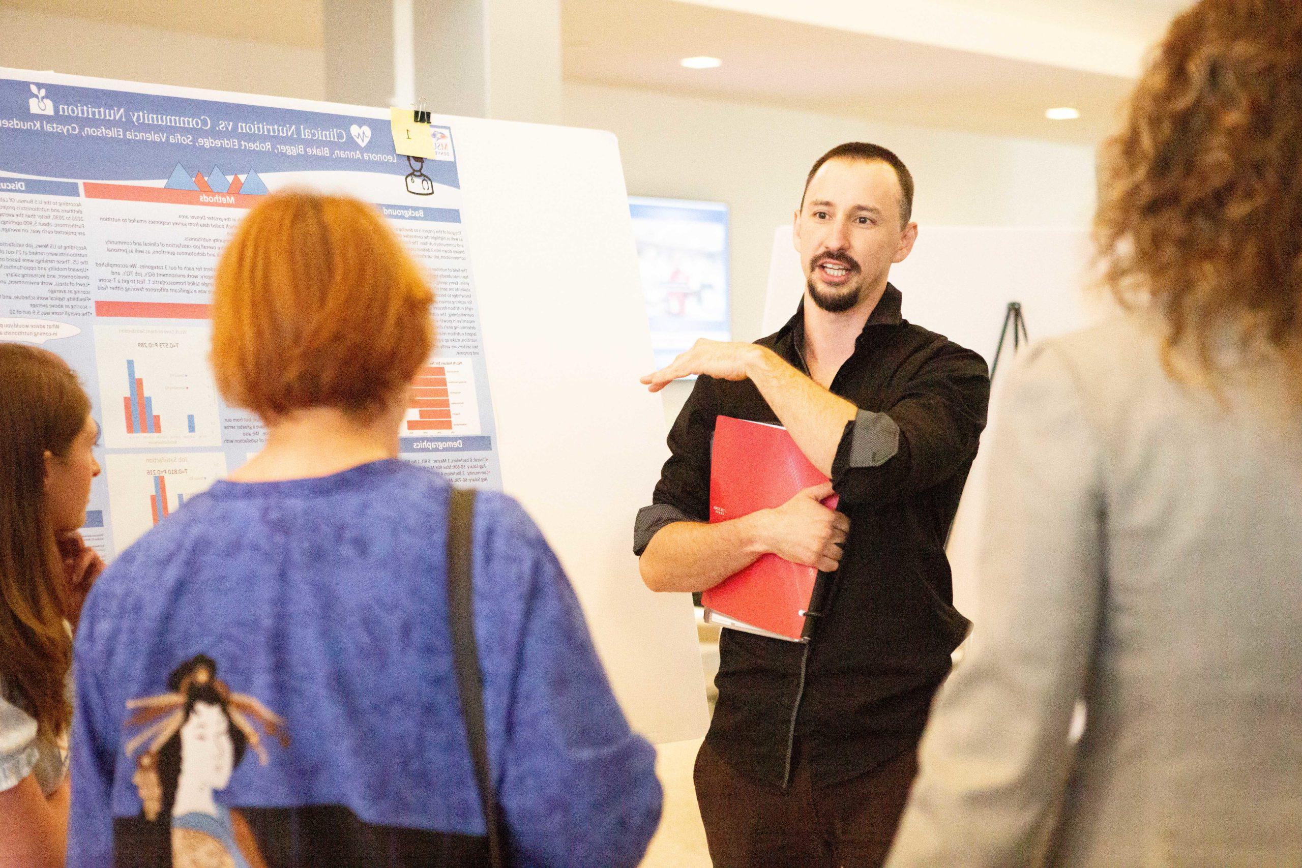 Student presenting at nutrition research day 2022.