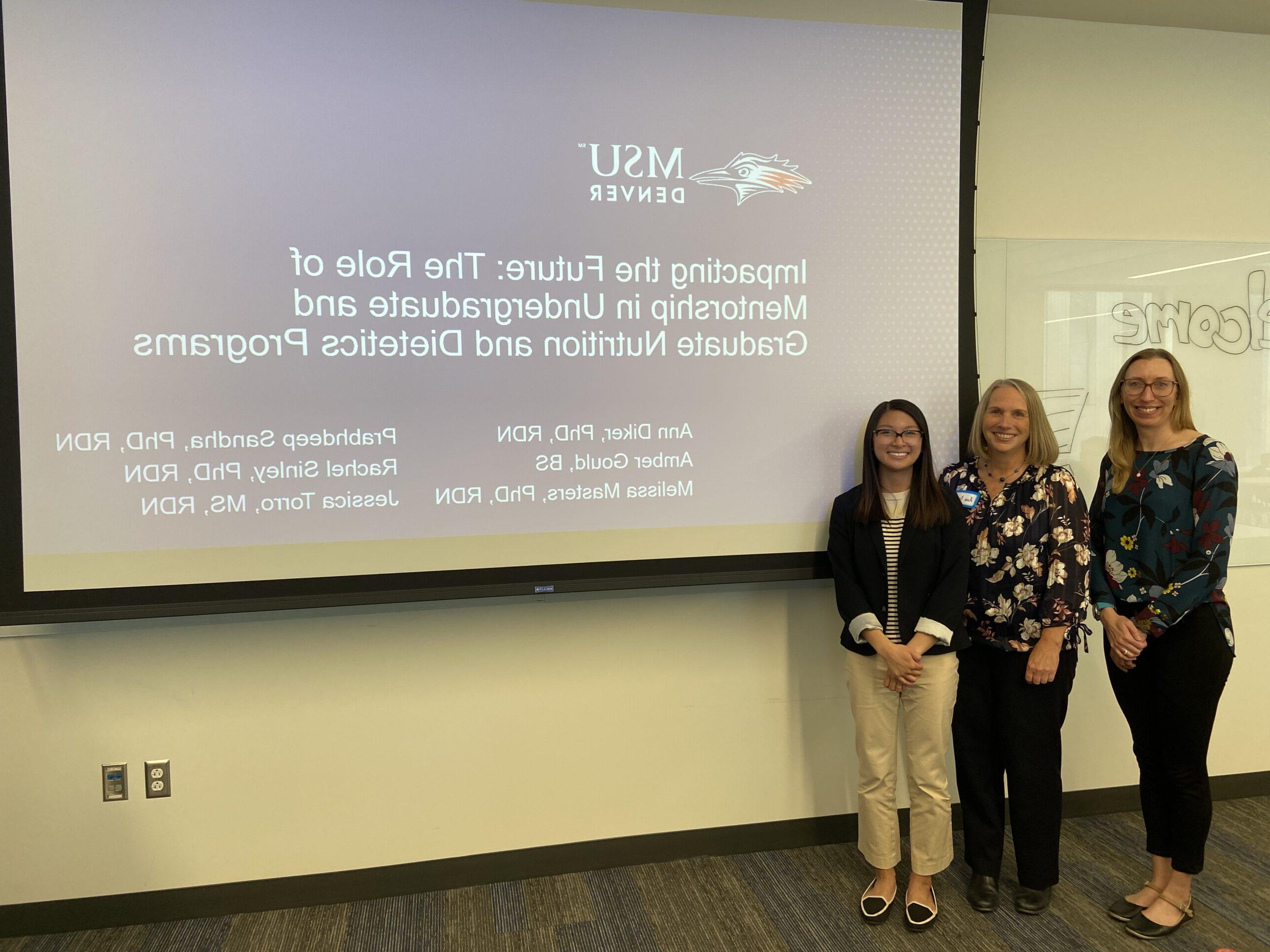 A photo of faculty members giving a presentation on the role of mentorship in Nutrition and Dietetics Programs.