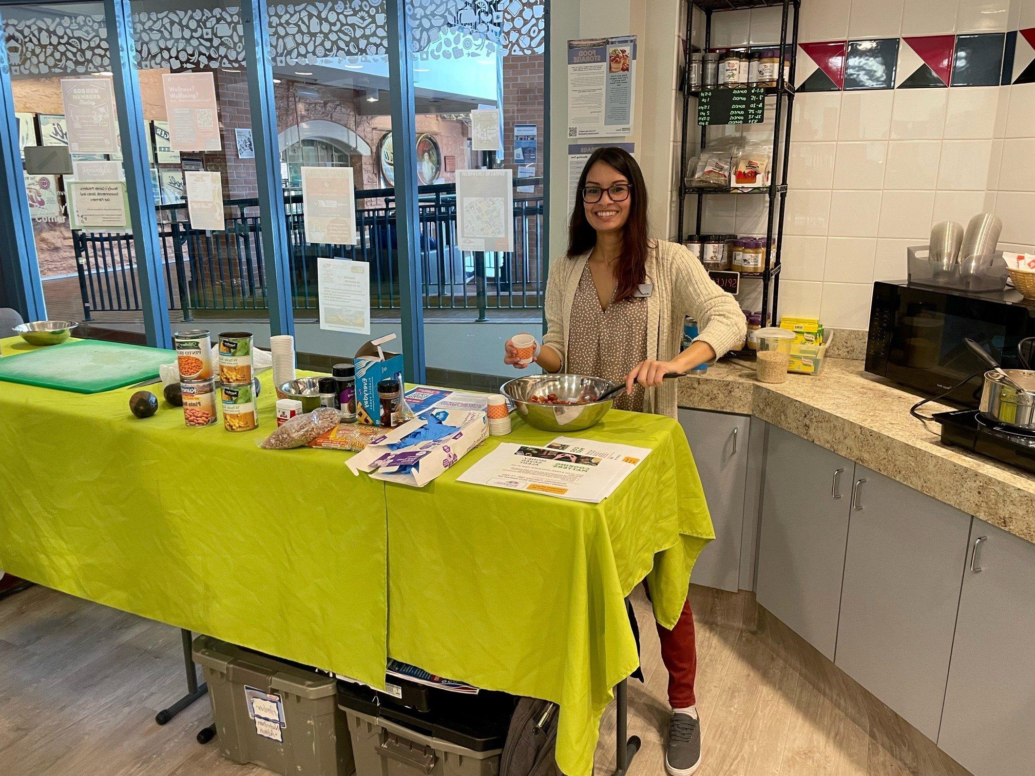 A photo of a student hosting a cooking demonstration.