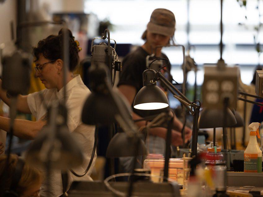 Students and Professor Boyd work in the Jewelry Studio.