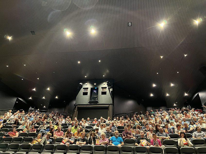 Image of the audience at the Denver Museum of Nature and Science for the 13th Annual Sci-Fi Film Series