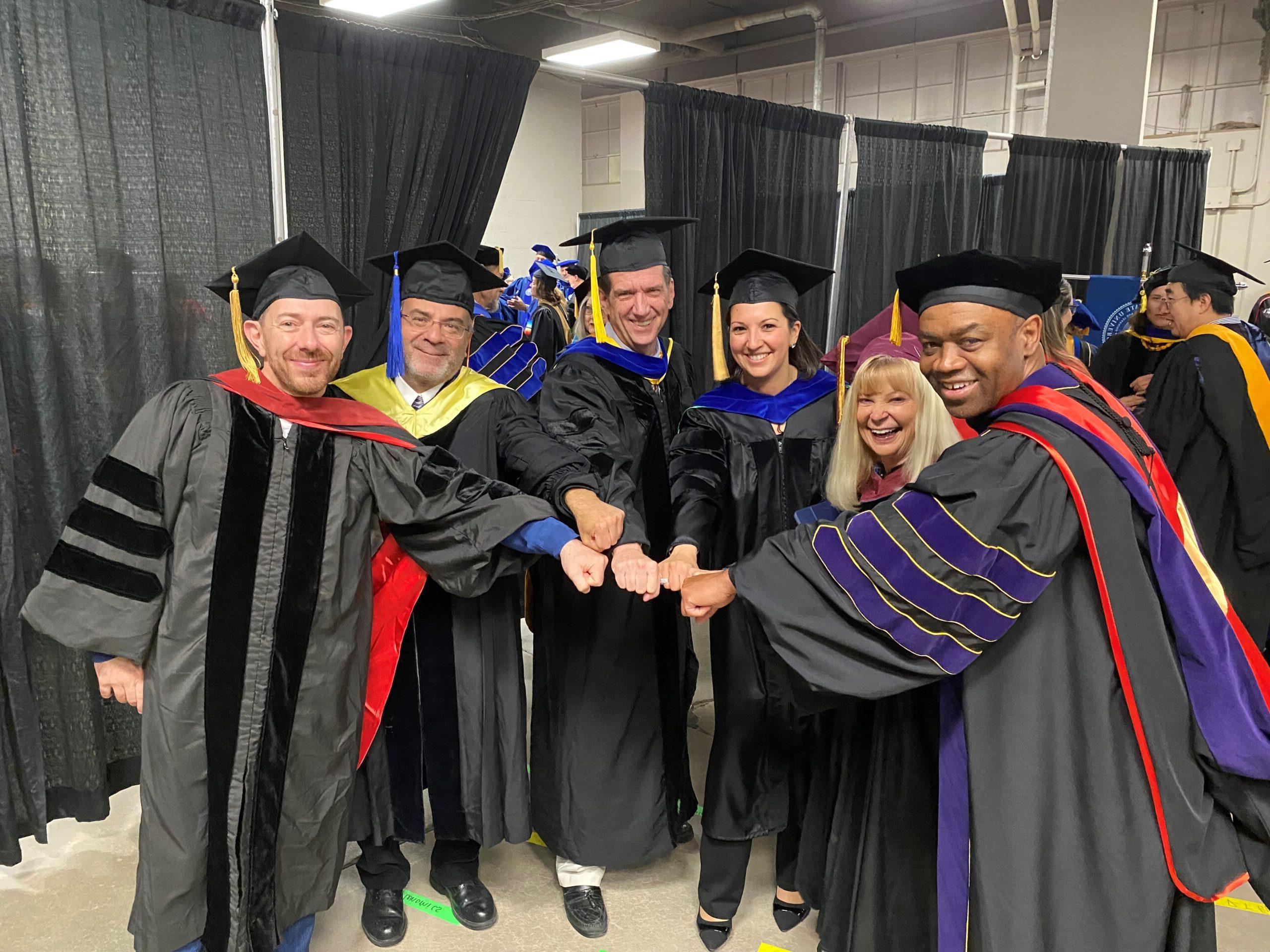 Spring 2024 Commencement - a group photo of the 6 College of Business Department Chairs in their regalia