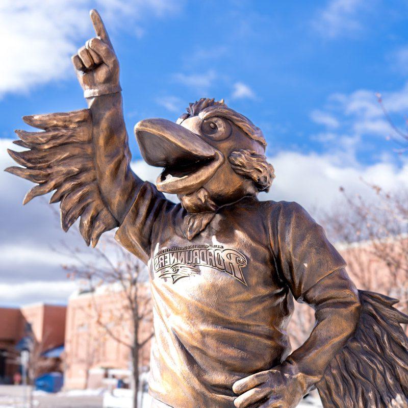 A close-up of the Rowdy the Roadrunner statue in front of the Tivoli on a sunny afternoon in January 2024