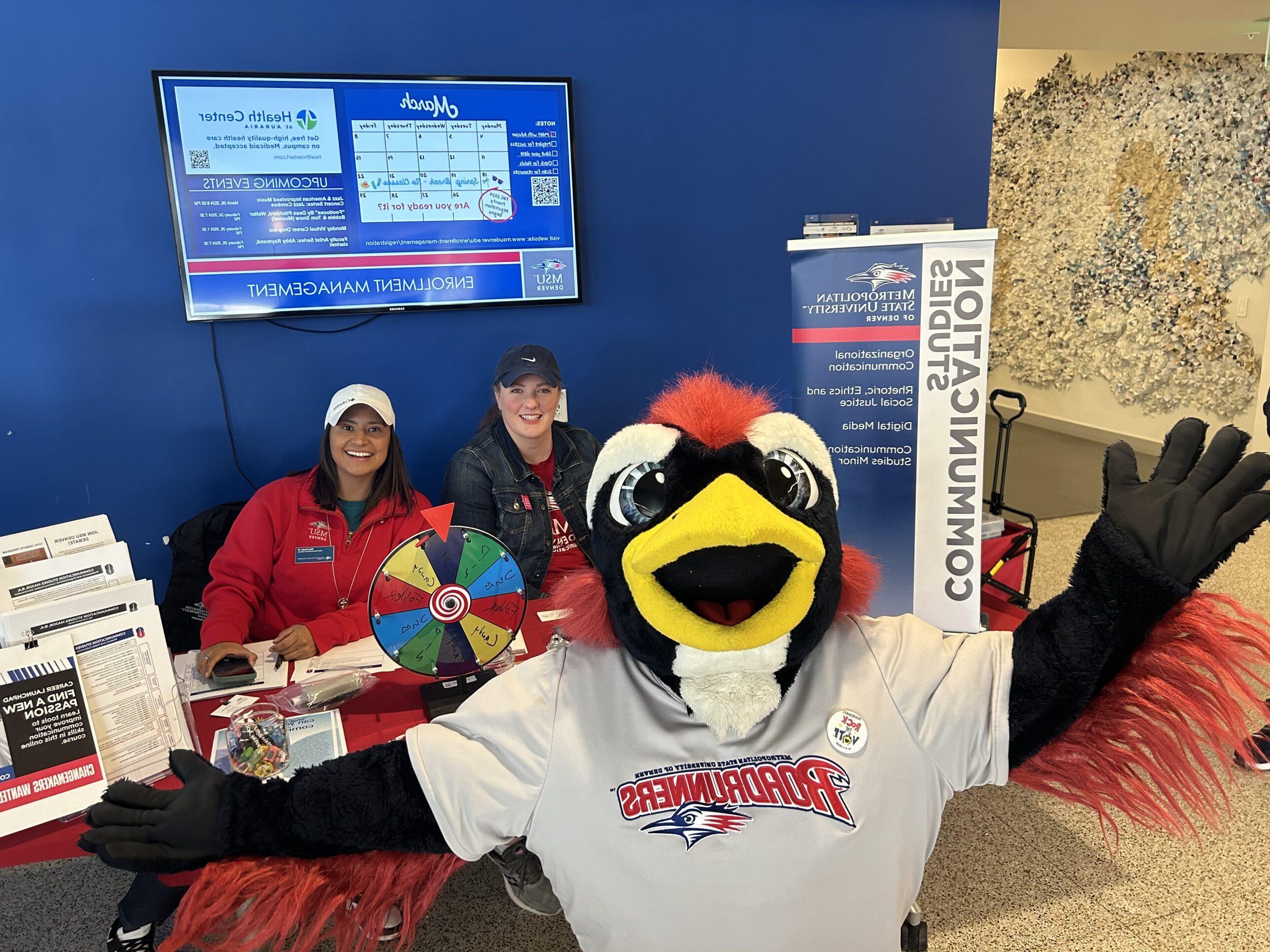 Rowdy the Roadrunner posing with Department of Communication Studies Professors