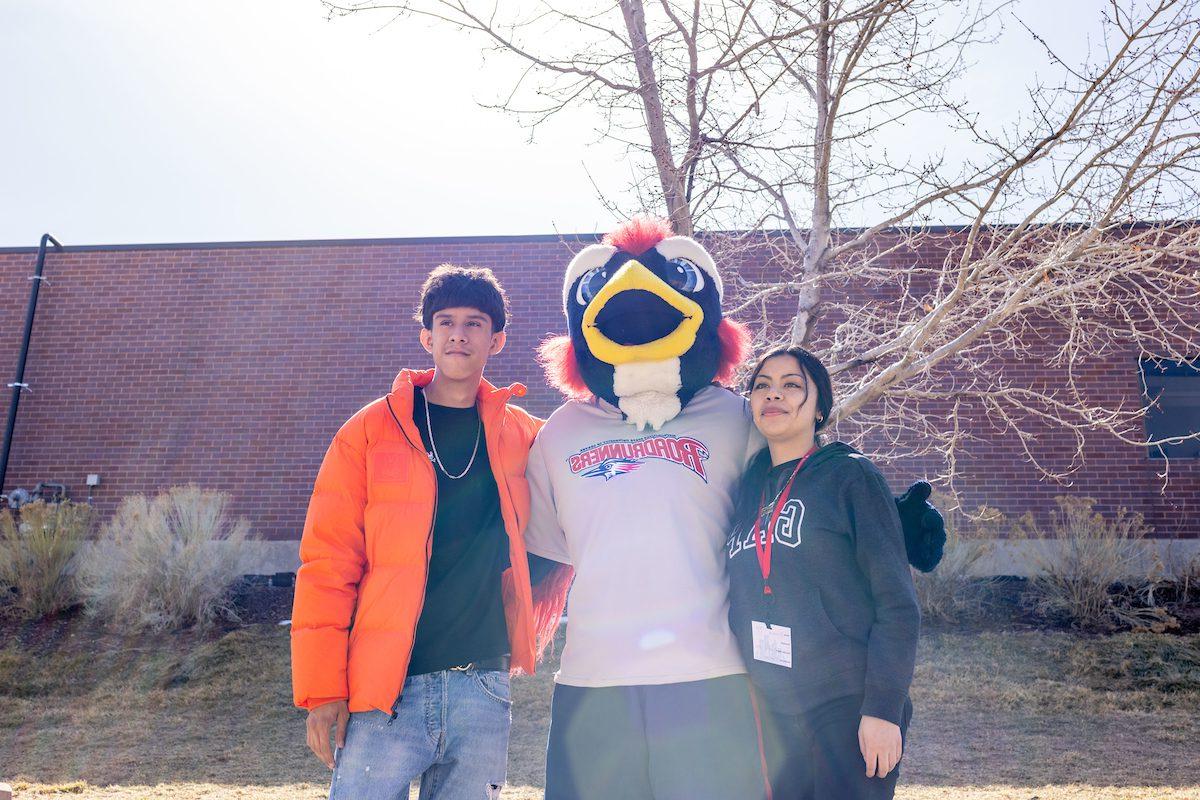 Two students pose with Rowdy the Roadrunner