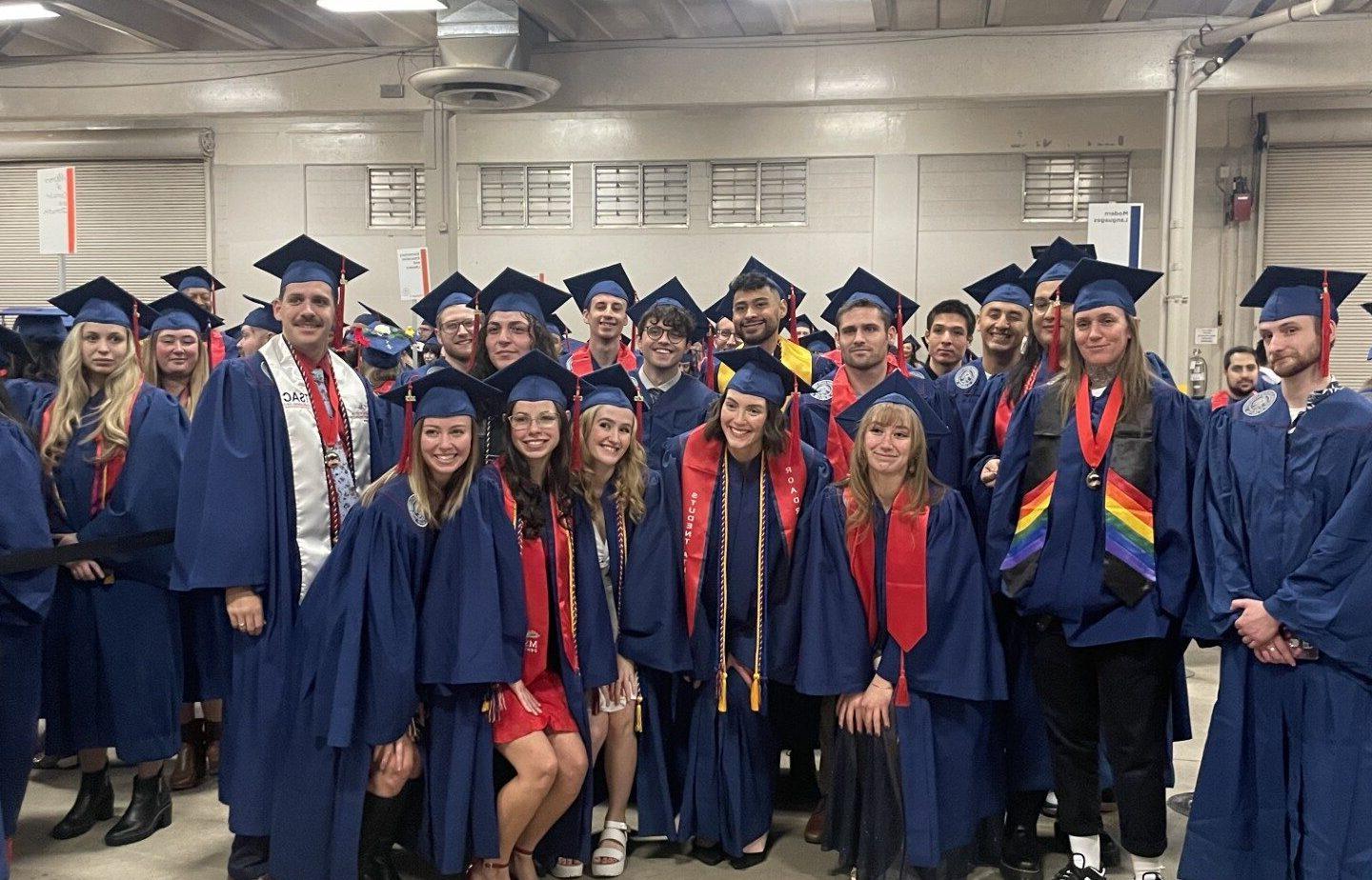 Journalism and Media Production graduates in cap and gown at MSU Denver Fall 2023 Commencement